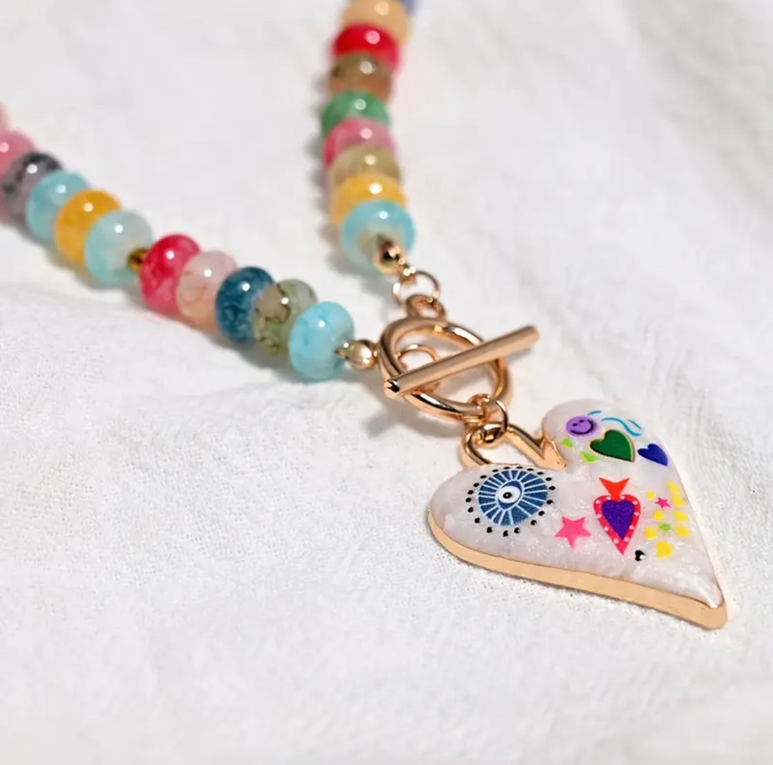 blue round eye pink star necklace