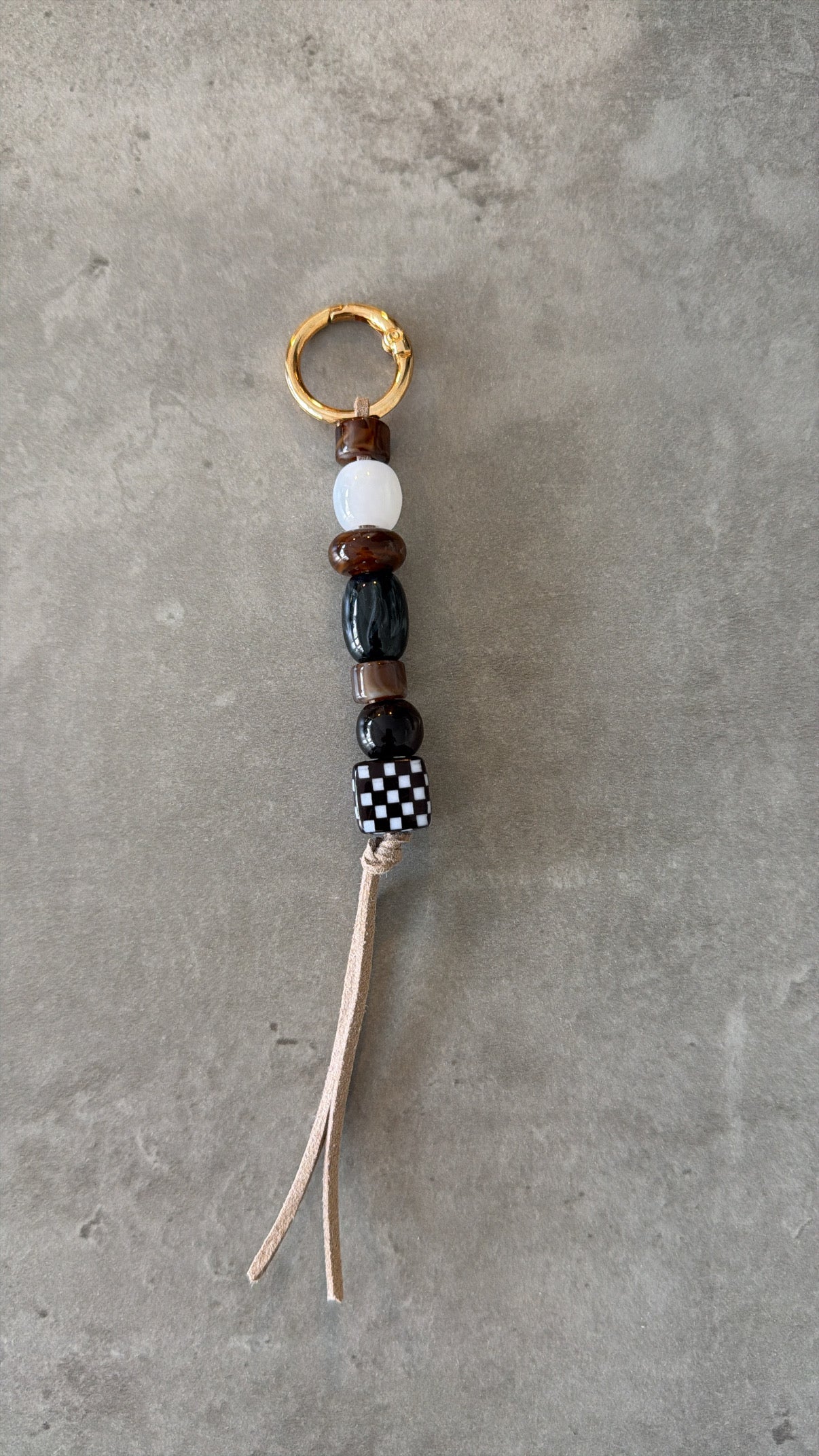 bag/key charm mixed  - browns, black & white