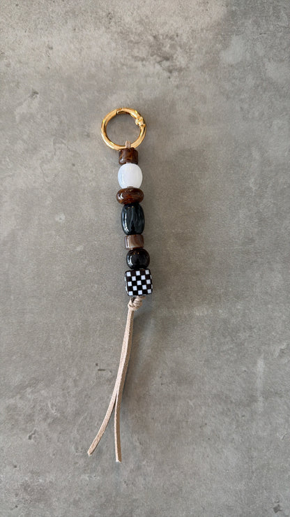 bag/key charm mixed  - browns, black & white