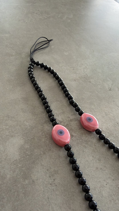black with pink oval eyes short phonestrap
