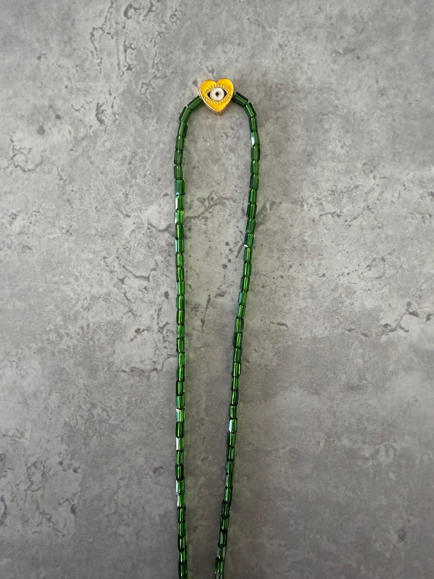 yellow eye heart necklace
