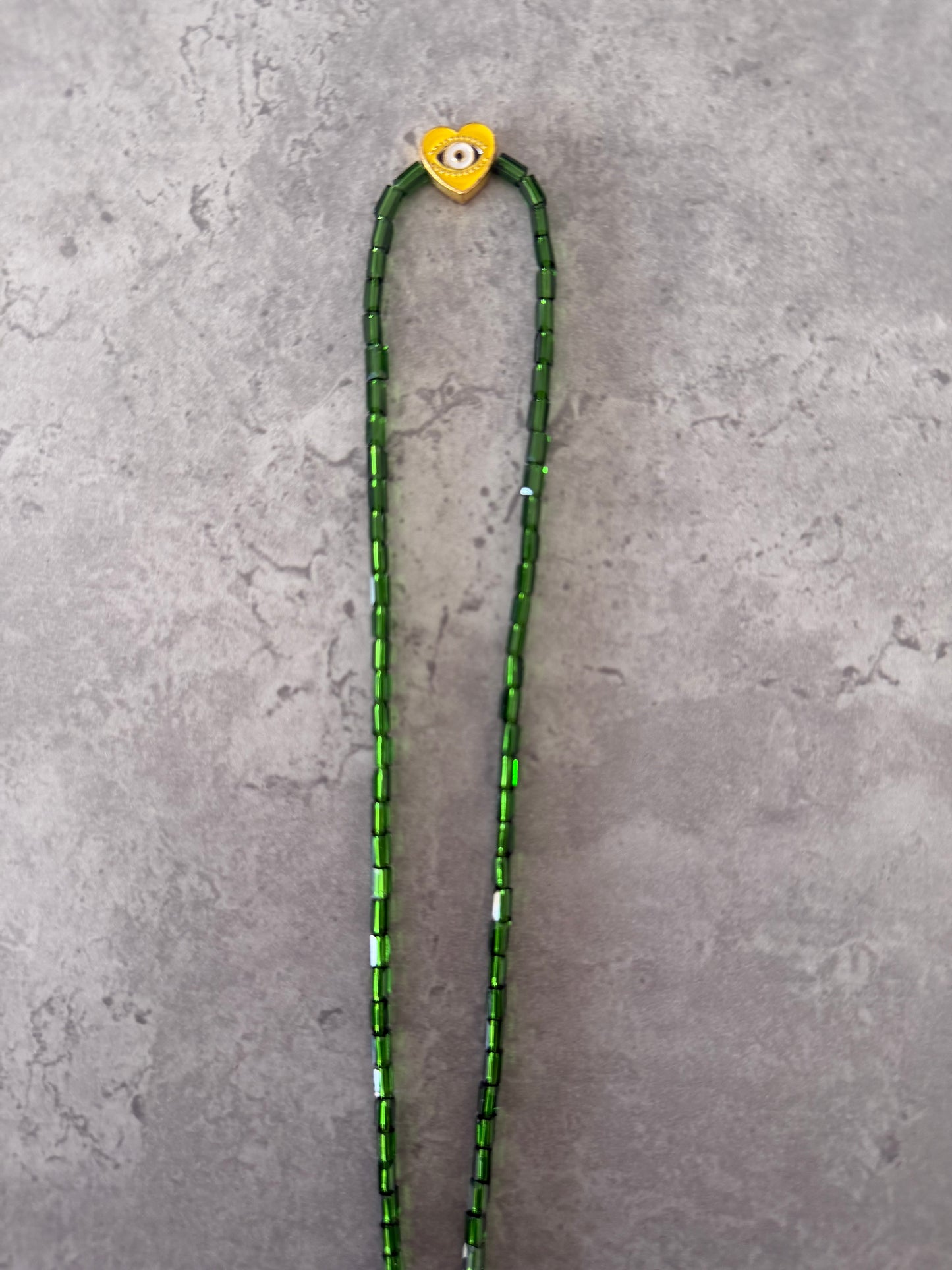 yellow eye heart necklace