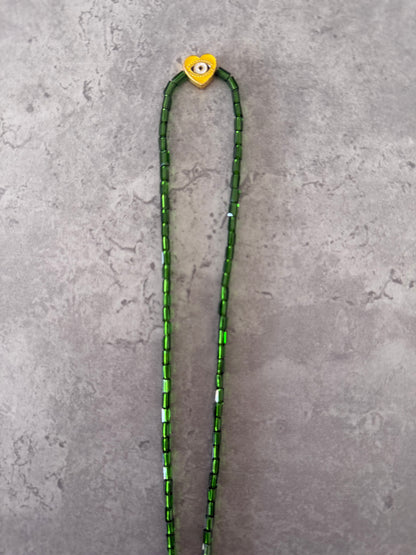 yellow eye heart necklace