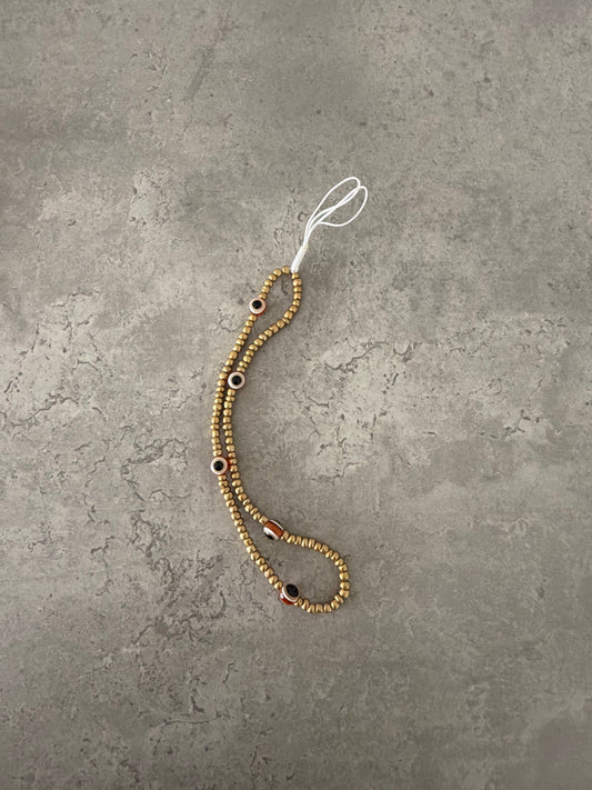 gold eye phonestrap