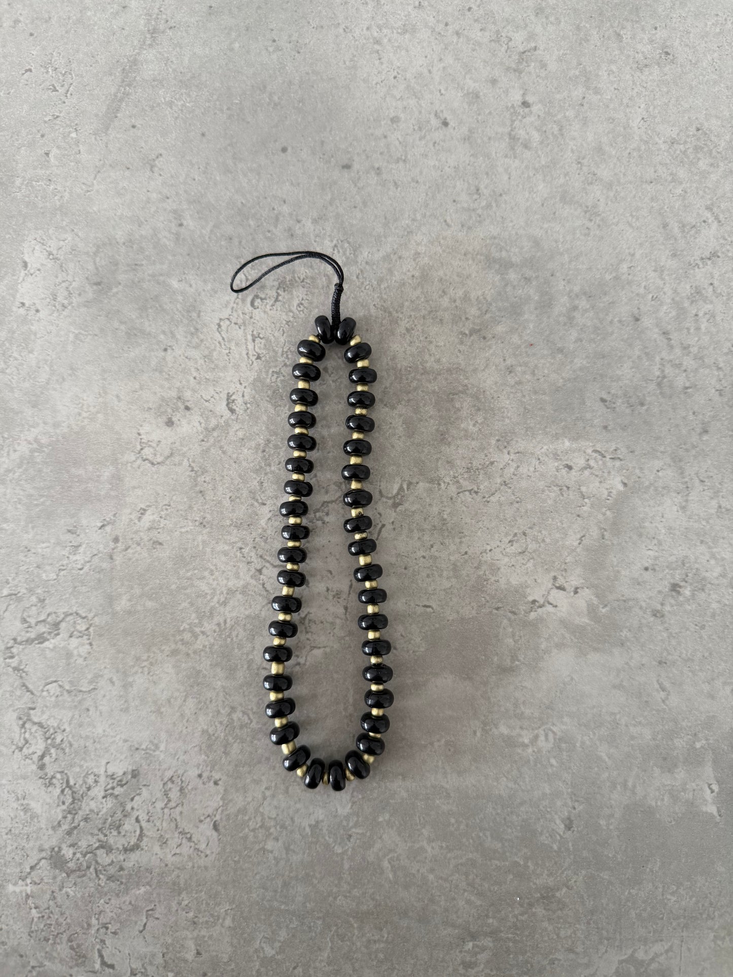 black and gold short strap