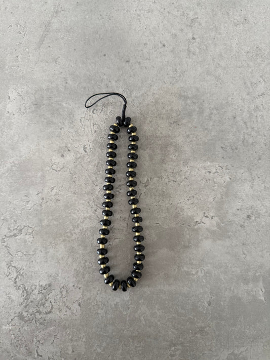 black and gold short strap