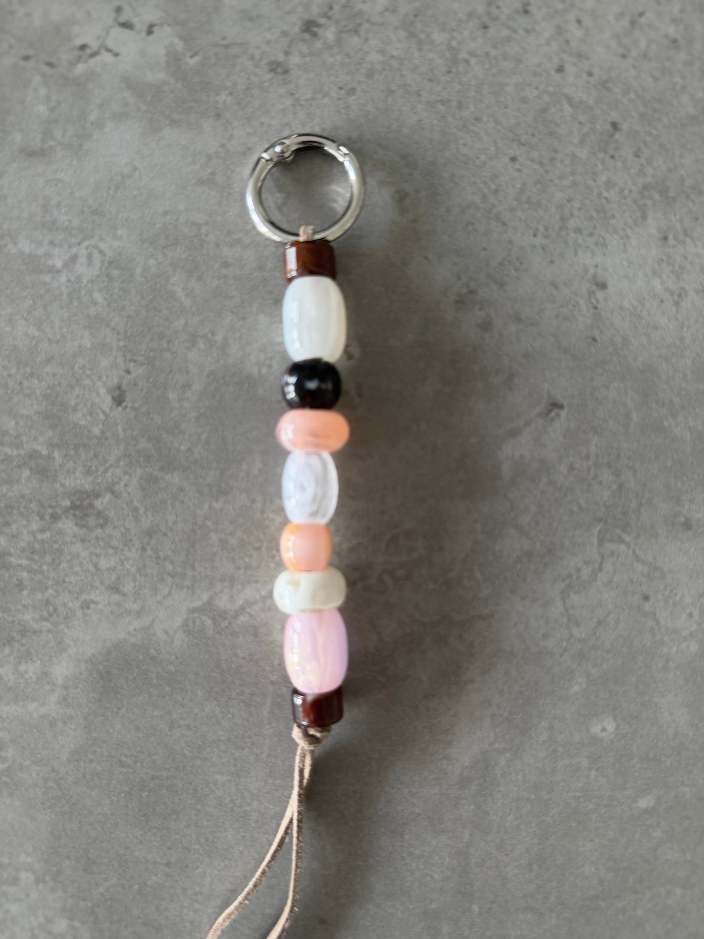 multicolor peach, pink, brown, cream bag/key charm