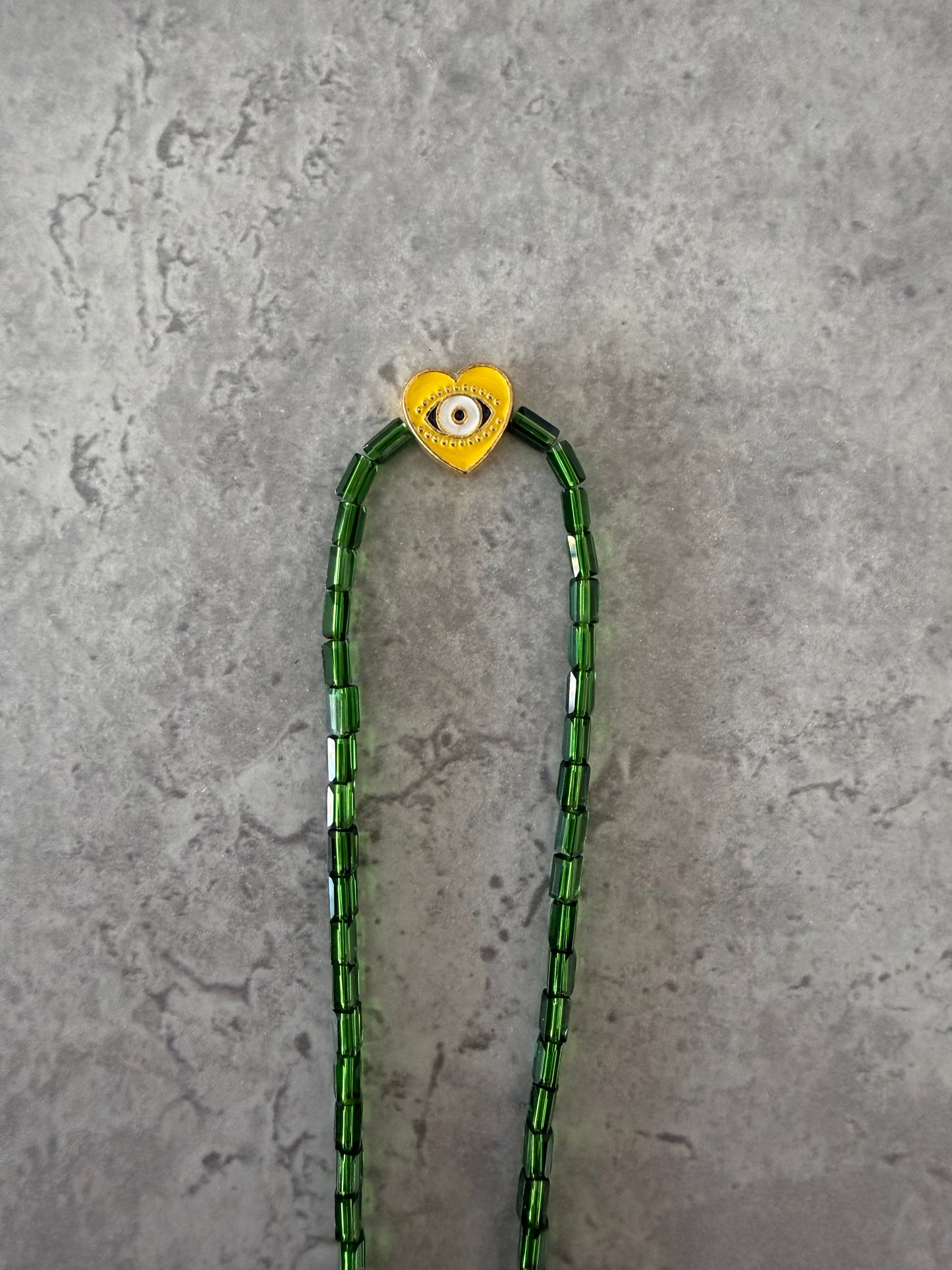 yellow eye heart necklace
