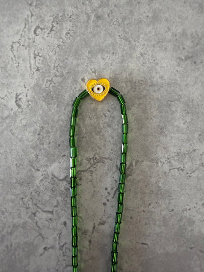 yellow eye heart necklace
