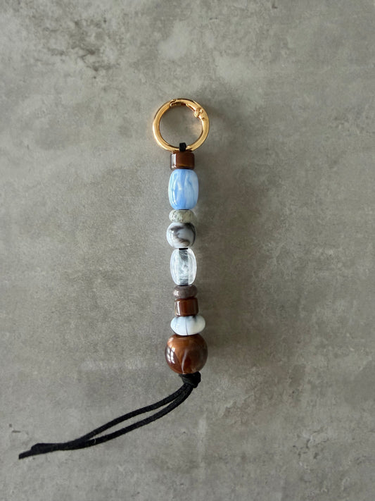 baby blue, greys, brown bag/key charm