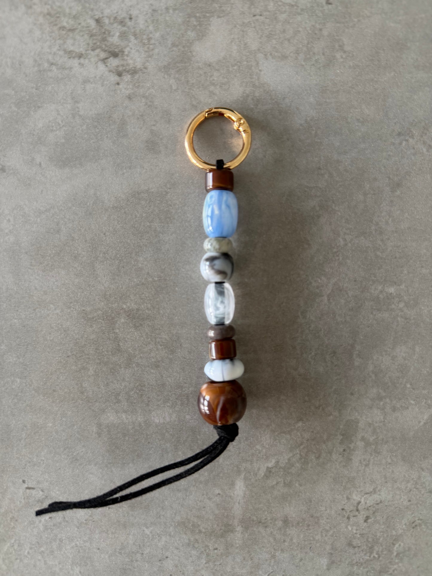 baby blue, greys, brown bag/key charm