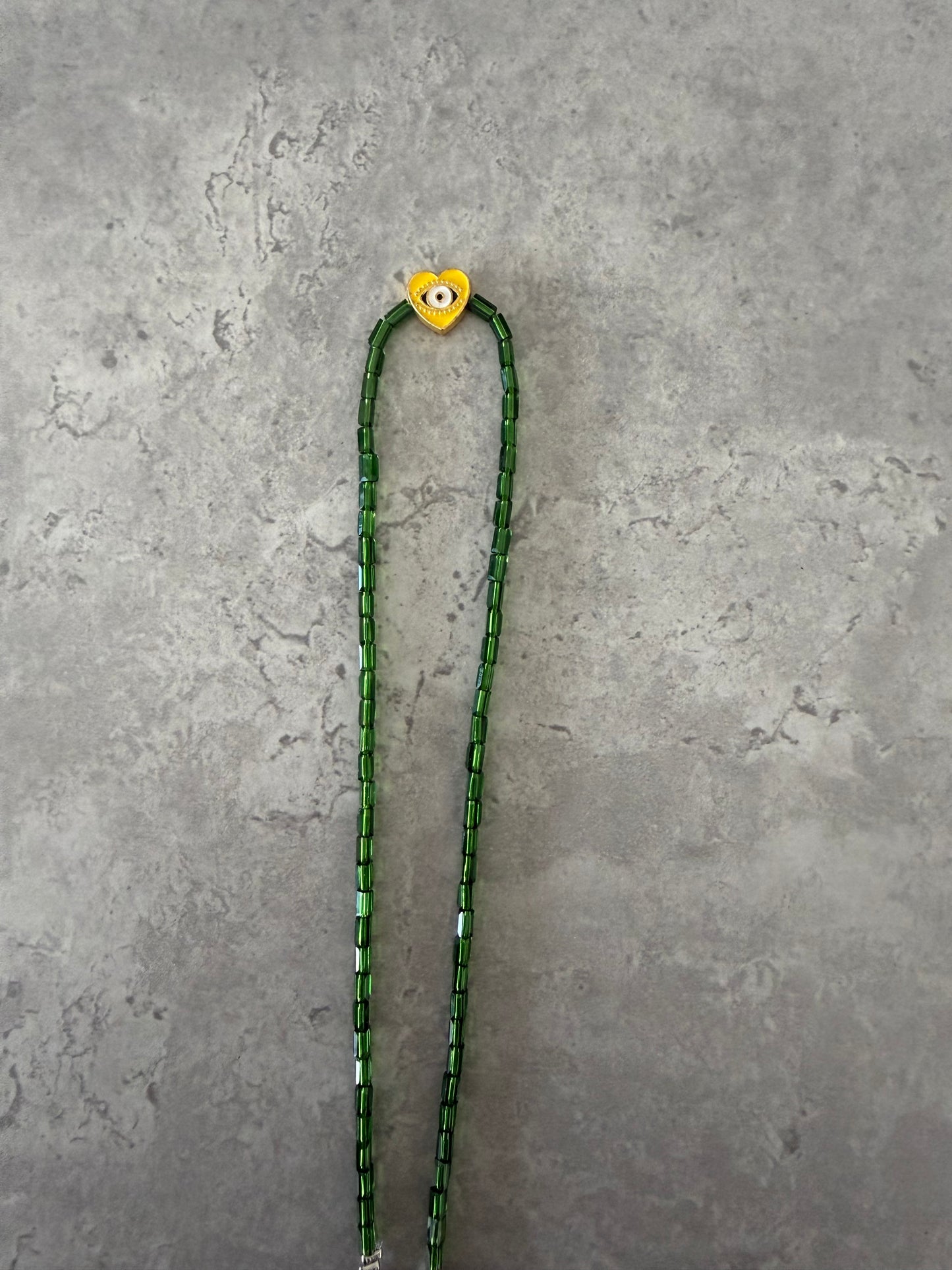 yellow eye heart necklace