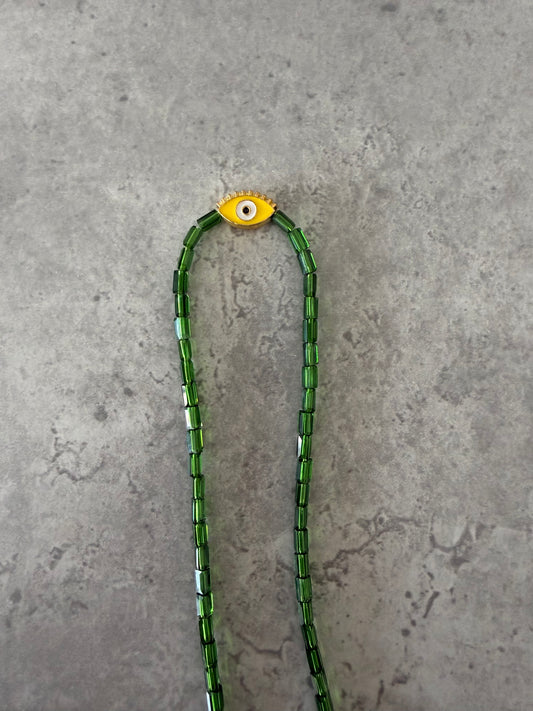 yellow eye oval necklace