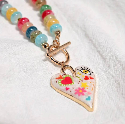 yellow eye red heart necklace