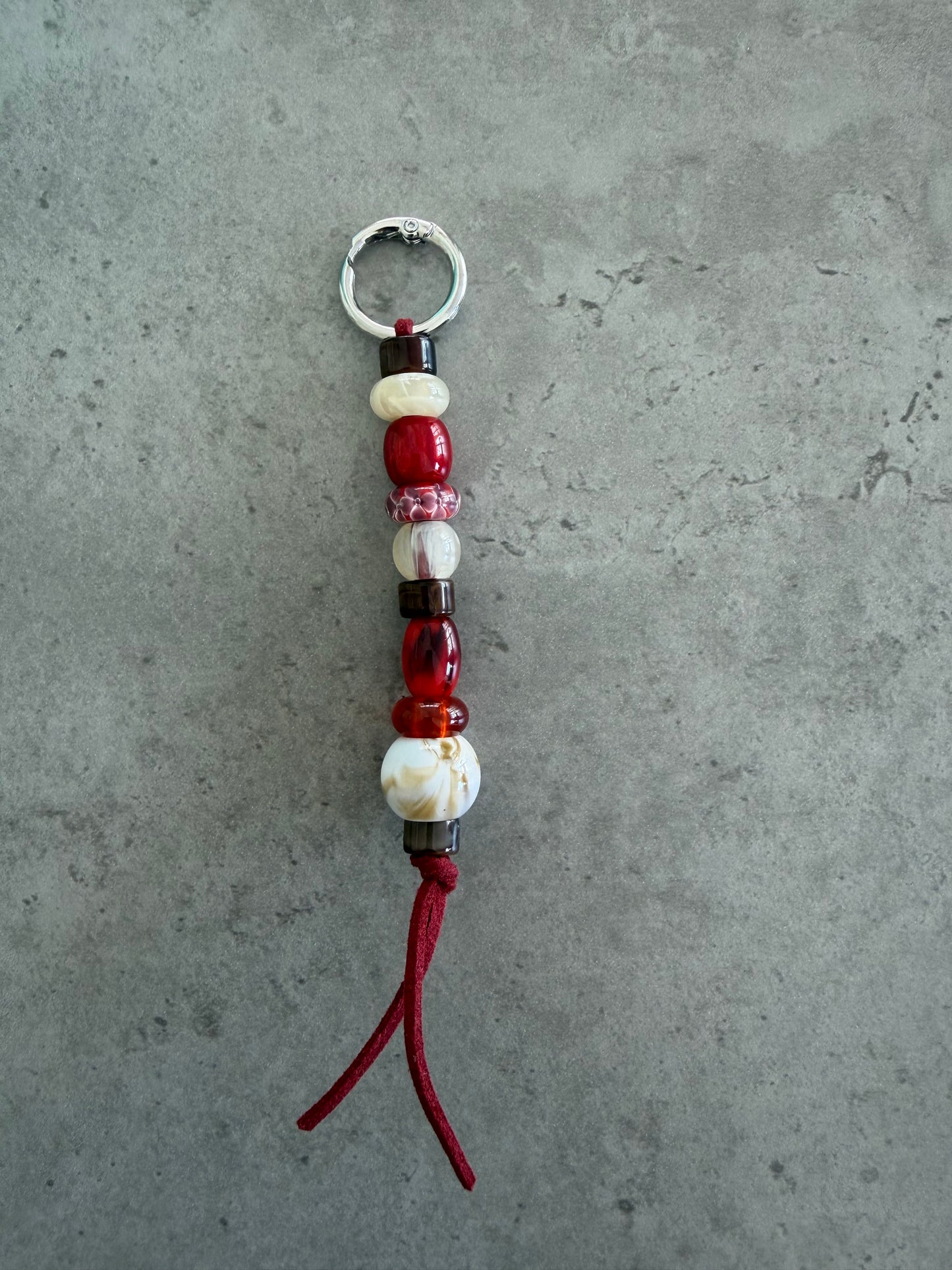 bag/key charm - reds creams brown