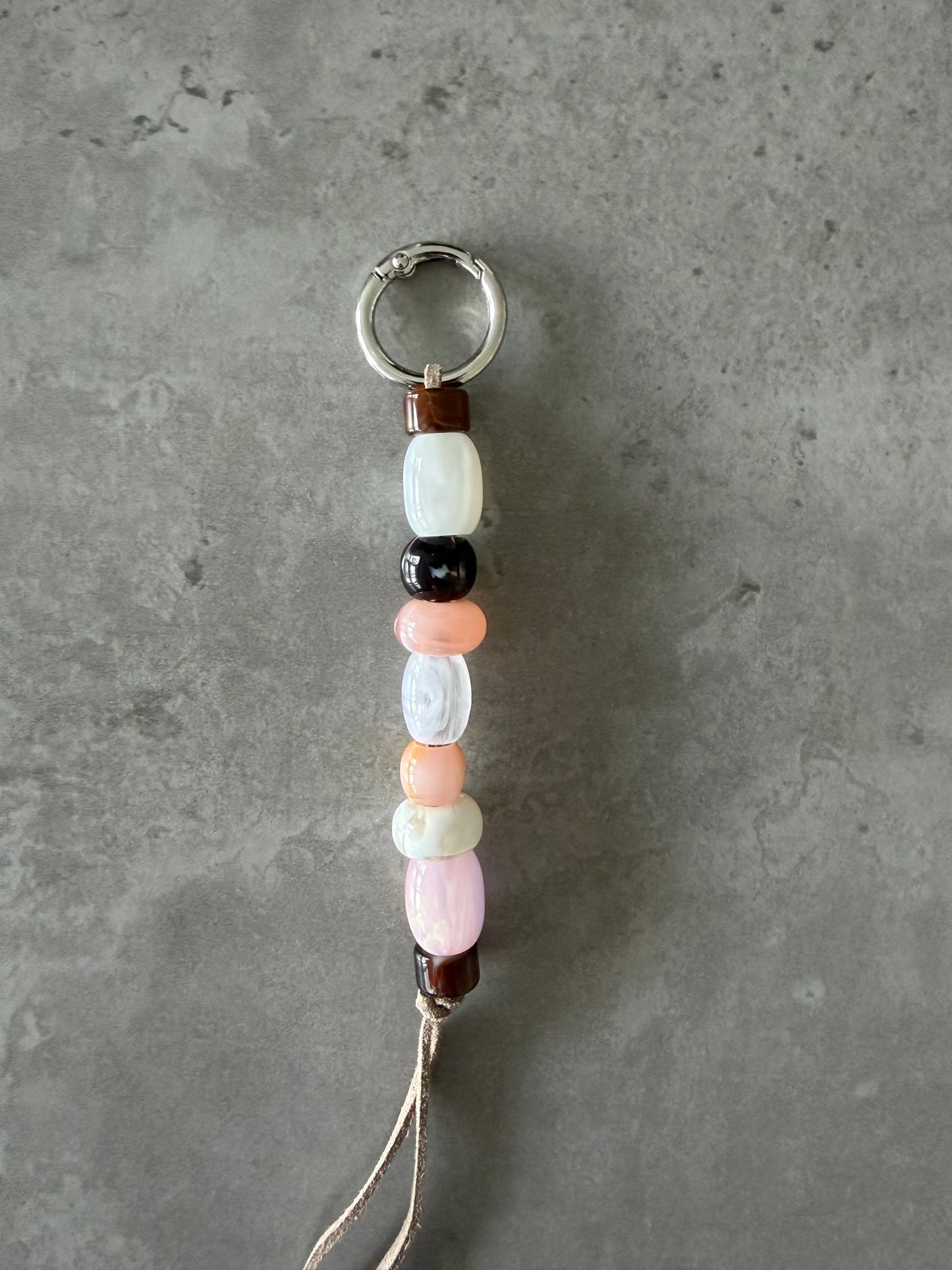 multicolor peach, pink, brown, cream bag/key charm