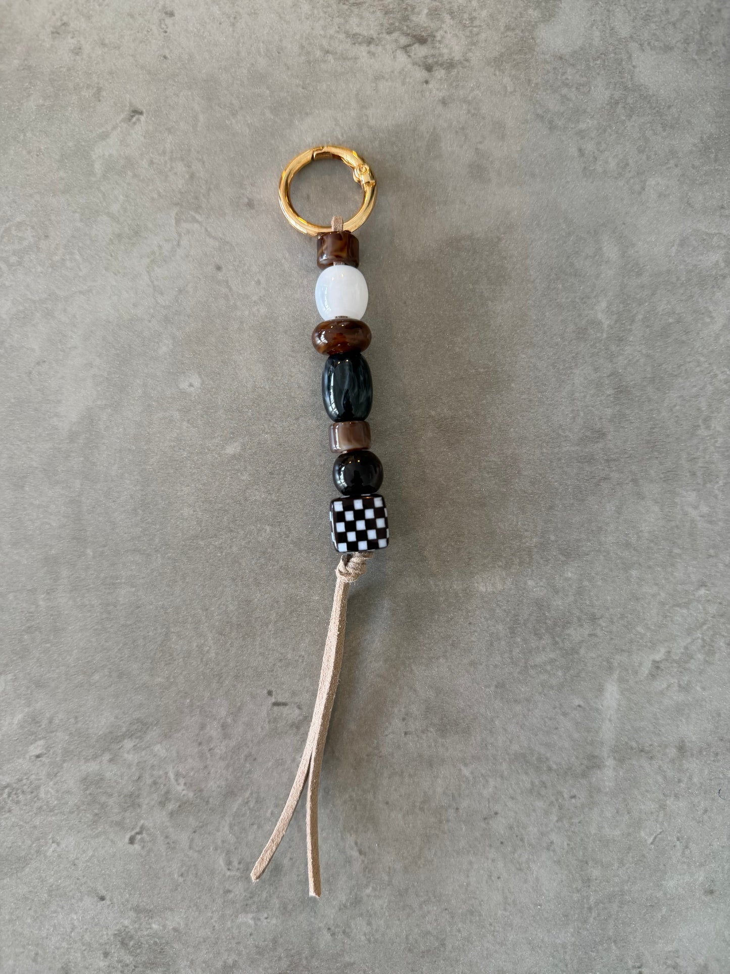 bag/key charm mixed  - browns, black & white